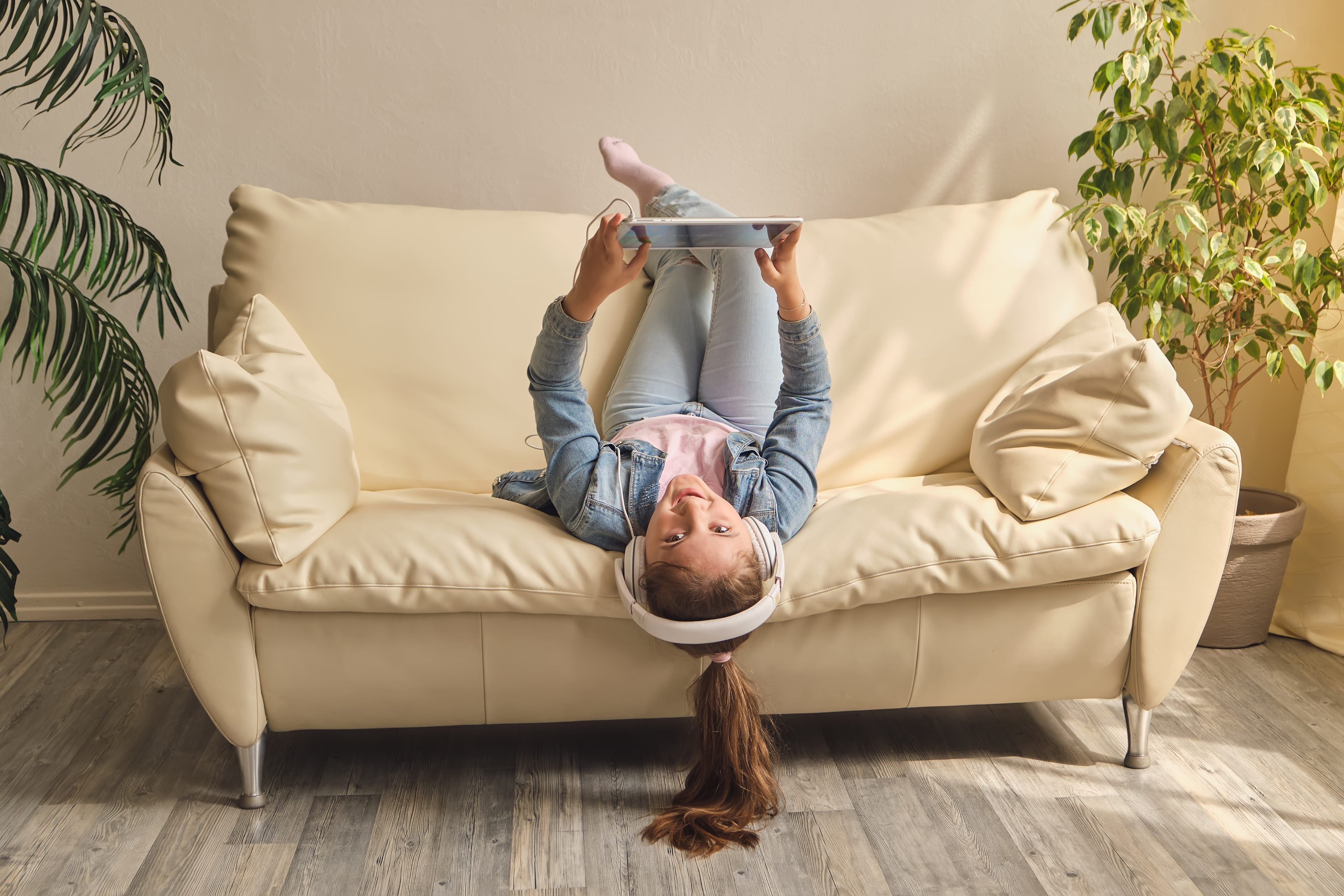 Child reading on couch in warm insulated home