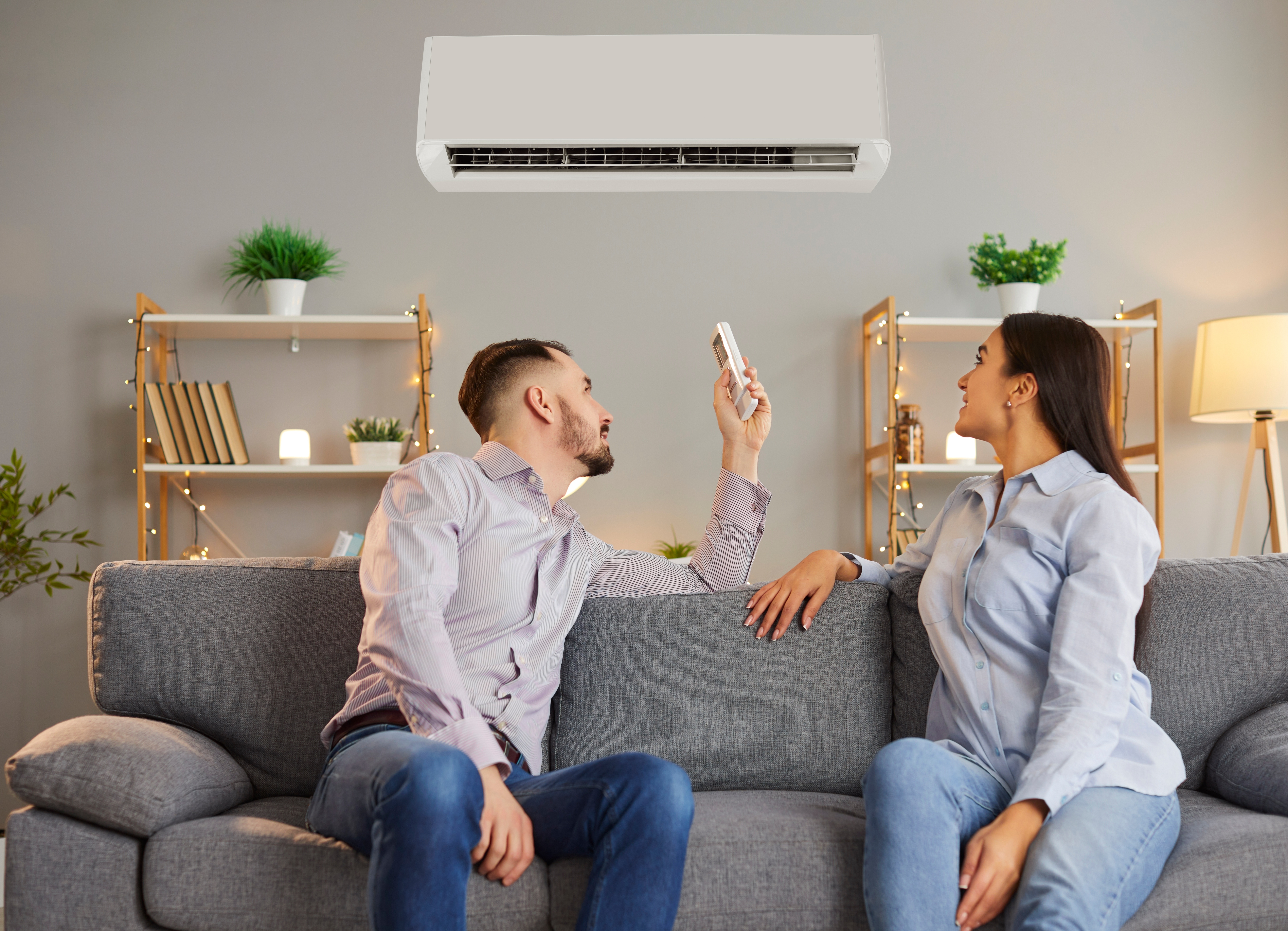Kiwi couple enjoys the comfort of a new heat pump installed in their living area through the EECA warmer kiwi homes funding.
